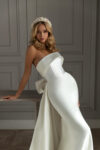 Sheath wedding dress with overskirt and bow